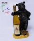 Подставка для бутылки, медведь обнимает бутылку.